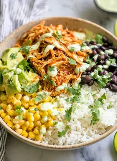 Delicious Chicken Burrito Bowl with rice, beans, and fresh toppings