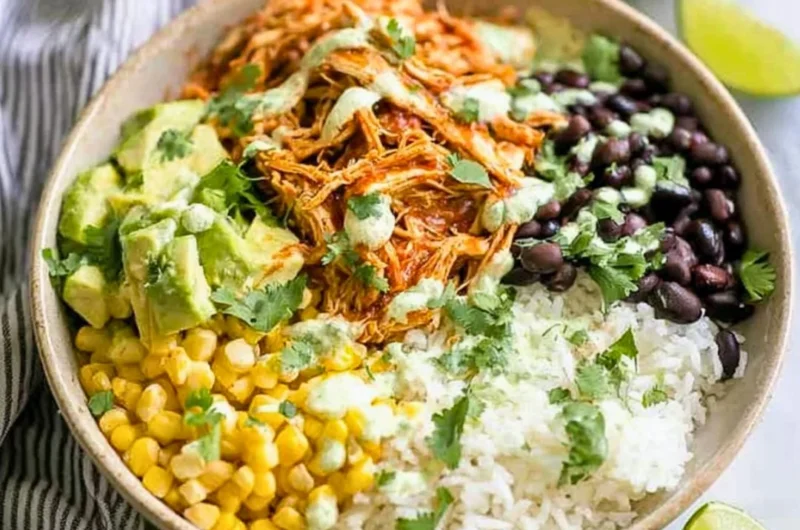 Delicious Chicken Burrito Bowl with rice, beans, and fresh toppings