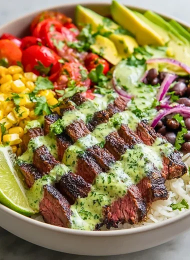 Cilantro lime steak bowls with fresh vegetables and rice in a vibrant bowl