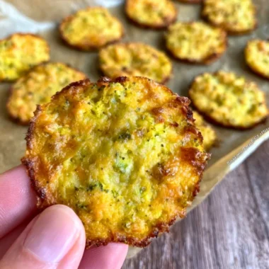 Crispy broccoli cheddar rounds arranged on a plate, perfect low carb snack.