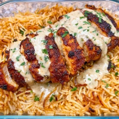 High Protein Creamy Cajun Chicken served with rice in a bowl.