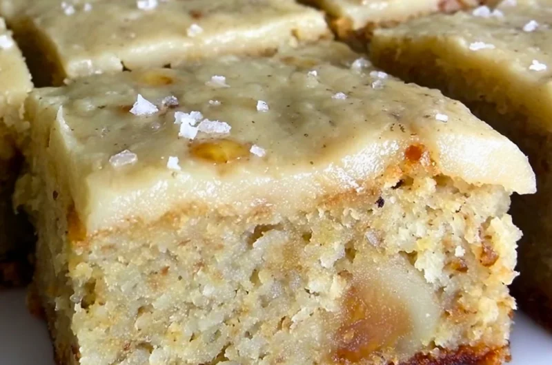 Irresistible banana bread brownies with brown butter frosting on a plate