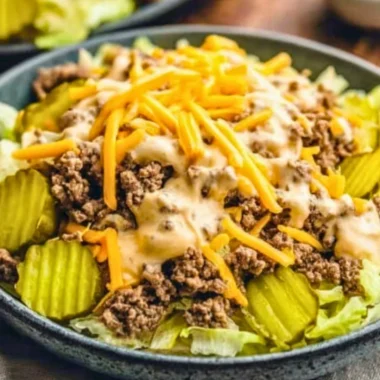Keto Big Mac Salad with lettuce, cheese, and special sauce on a plate