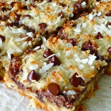 Decadent Magic Cookie Bars with layers of chocolate, coconut, and nuts