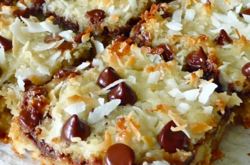 Decadent Magic Cookie Bars with layers of chocolate, coconut, and nuts