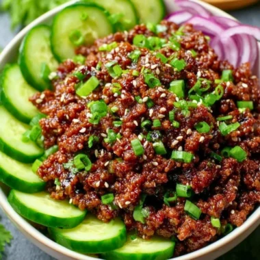 Spicy Keto Korean Beef served with a refreshing cucumber salad