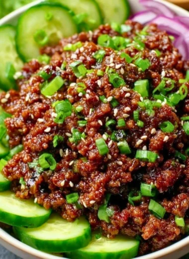 Spicy Keto Korean Beef served with a refreshing cucumber salad