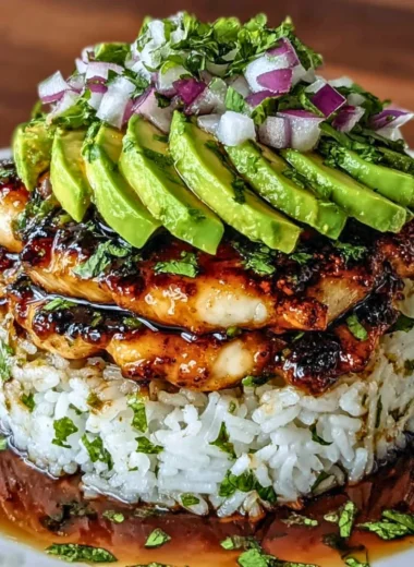 Delicious honey lime chicken with avocado rice stack on a plate