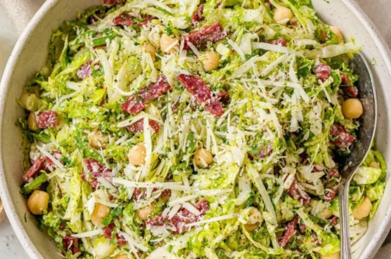A colorful bowl of Scala chopped salad with fresh vegetables and dressing