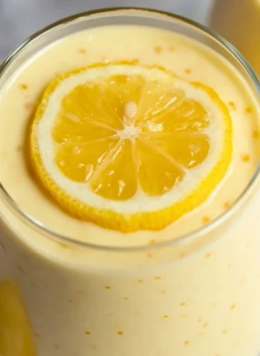 Delicious lemon cream chia pudding served in a bowl with fresh lemon slices