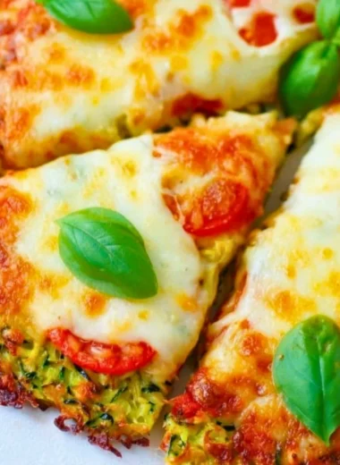 Zucchini pizza crust topped with fresh ingredients and cheese