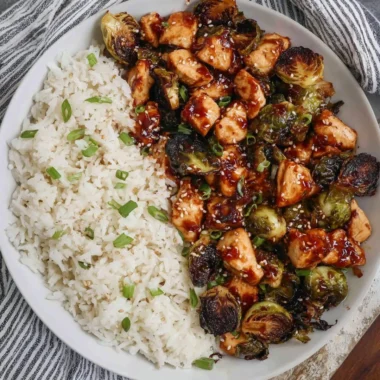 Plate of air fried chicken breast and Brussels sprouts, a healthy meal option.