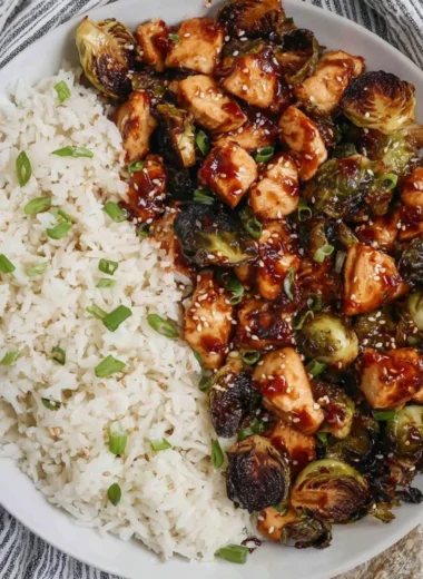 Plate of air fried chicken breast and Brussels sprouts, a healthy meal option.
