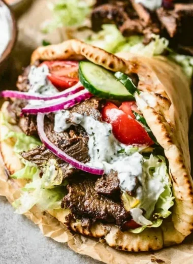 Delicious homemade Beef Gyros served with fresh toppings.