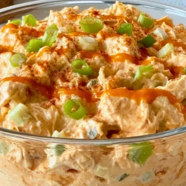 Buffalo Chicken Salad with lettuce, tomatoes, and blue cheese dressing