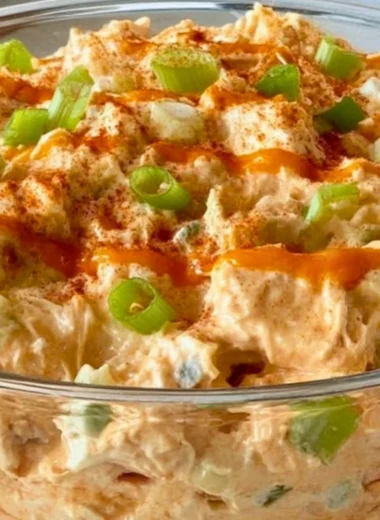 Buffalo Chicken Salad with lettuce, tomatoes, and blue cheese dressing