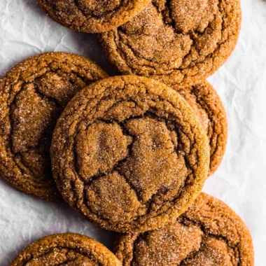 Delicious chewy pumpkin spice molasses cookies on a rustic table.