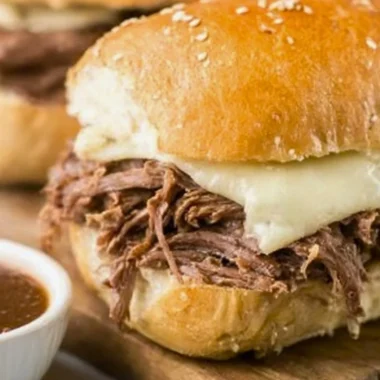 Crock Pot French Dip sandwich served with au jus for dipping