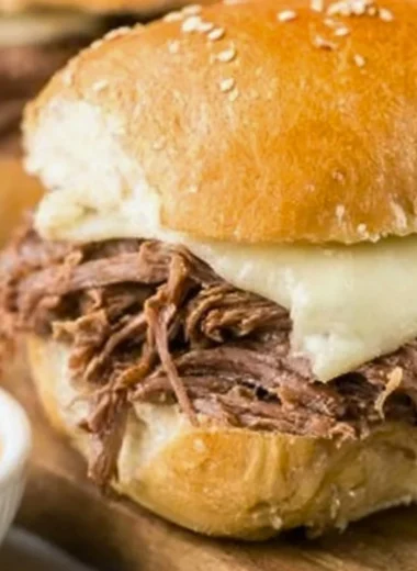 Crock Pot French Dip sandwich served with au jus for dipping