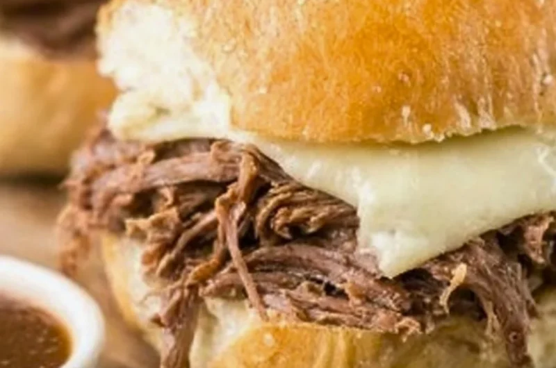 Crock Pot French Dip sandwich served with au jus for dipping