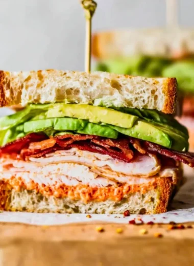 Easy turkey club sandwich with layers of turkey, bacon, lettuce, and tomato