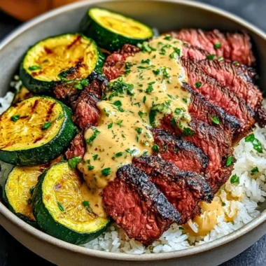 Delicious grilled steak bowl with sauce and grilled zucchini served in a bowl