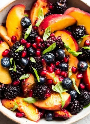 Delicious honey lime basil peach fruit salad with vibrant ingredients