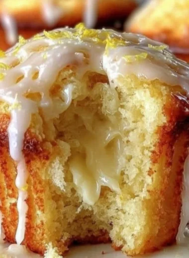 Moist and zesty Lemon Cream Cheese Muffins with cream cheese filling