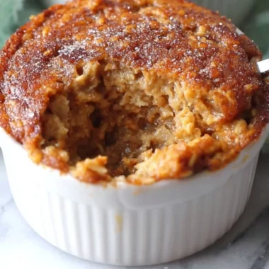 Homemade oatmeal muffin with nuts and fruits, perfect for a healthy snack.