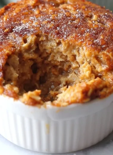 Homemade oatmeal muffin with nuts and fruits, perfect for a healthy snack.