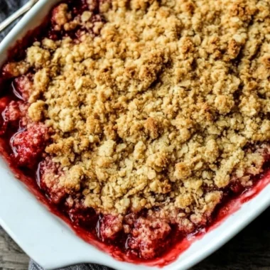 Delicious old-fashioned strawberry rhubarb crisp dessert with a golden topping