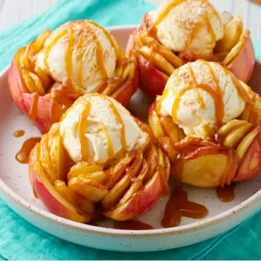Slow Cooker Bloomin' Baked Apples topped with caramel and nuts