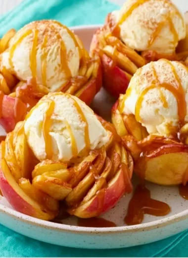Slow Cooker Bloomin' Baked Apples topped with caramel and nuts