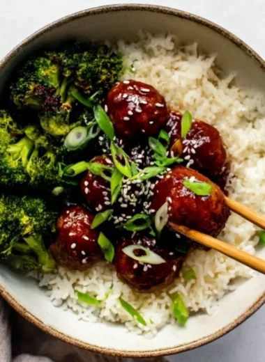 Delicious Sticky Mongolian Beef Meatballs served in a bowl with garnishes