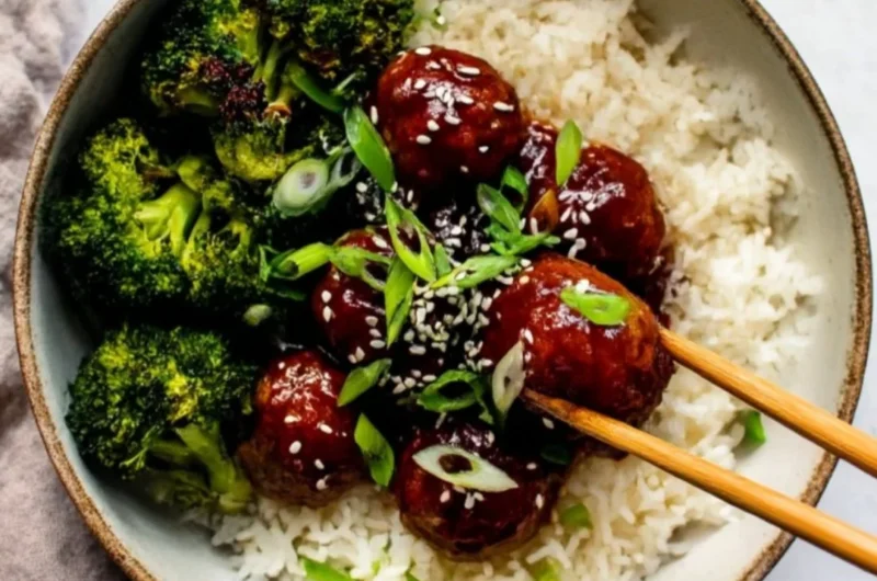 Delicious Sticky Mongolian Beef Meatballs served in a bowl with garnishes