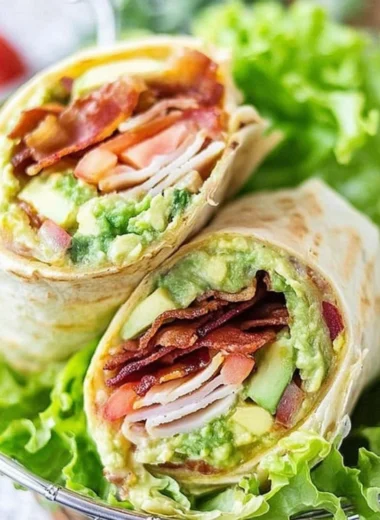 Delicious turkey bacon wrap with fresh vegetables and a light dressing