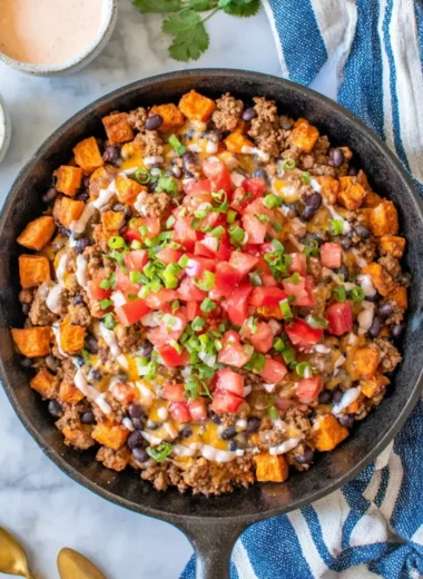Turkey Sweet Potato Skillet with colorful vegetables in a cast-iron pan