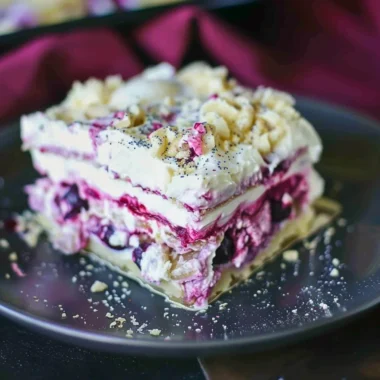 Delicious Blueberry Cream Cheesecake Lasagna served on a dessert plate