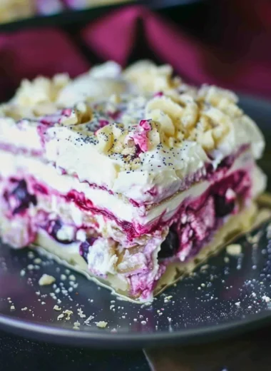 Delicious Blueberry Cream Cheesecake Lasagna served on a dessert plate