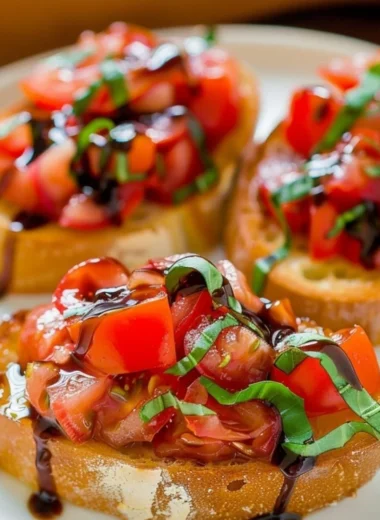 Delicious bruschetta topped with fresh tomatoes and basil on toasted bread.
