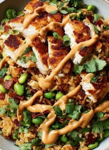 Delicious Chicken Crispy Rice Salad topped with creamy peanut dressing