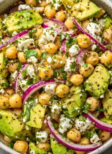 Chickpea Feta Avocado Salad with fresh ingredients in a bowl
