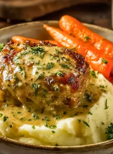 Creamy herb chicken served with mashed potatoes and honey glazed carrots.