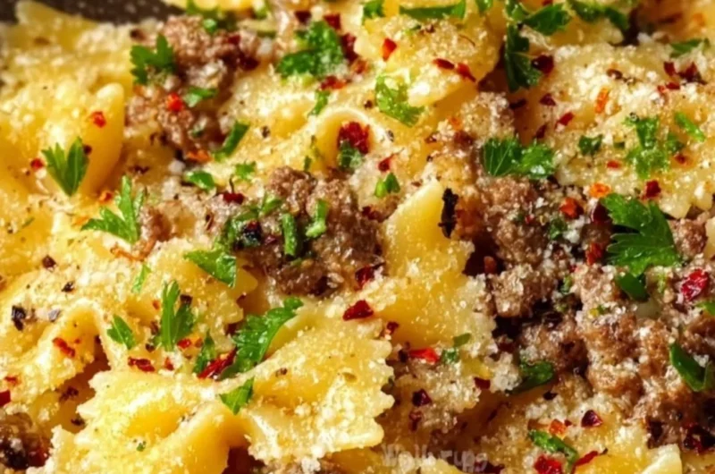 Delicious garlic butter bowtie pasta with ground beef served in a bowl.