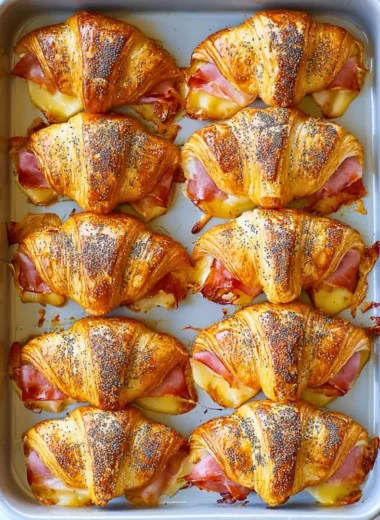Ham and cheese mini croissant sandwiches on a platter