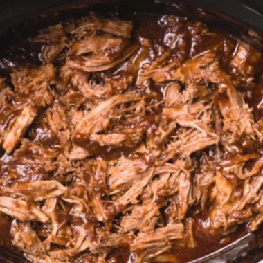 Delicious BBQ pulled pork in a slow cooker, perfect for flavorful meals