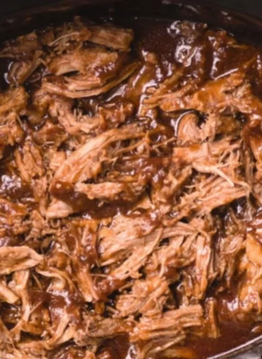Delicious BBQ pulled pork in a slow cooker, perfect for flavorful meals