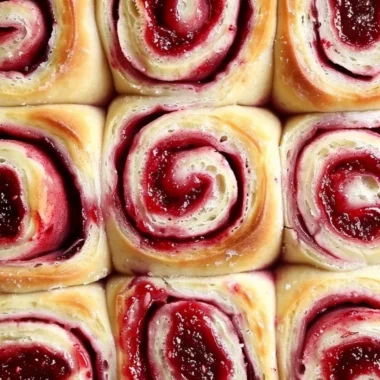 Freshly baked sourdough raspberry lemon rolls ready to enjoy.