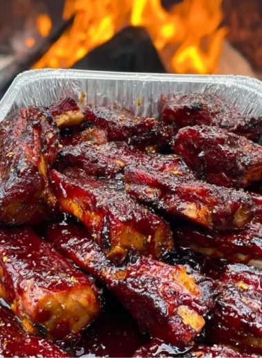 Delicious BBQ ribs served with a side of coleslaw and cornbread