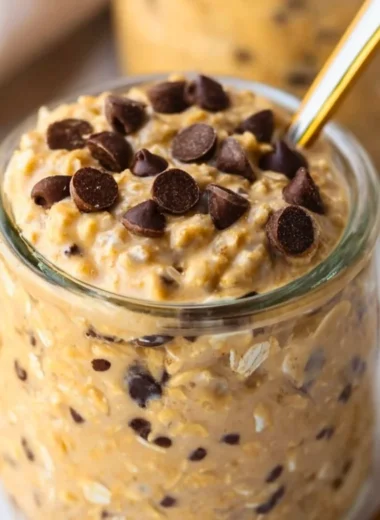 Delicious cookie dough overnight oats topped with chocolate chips and nuts